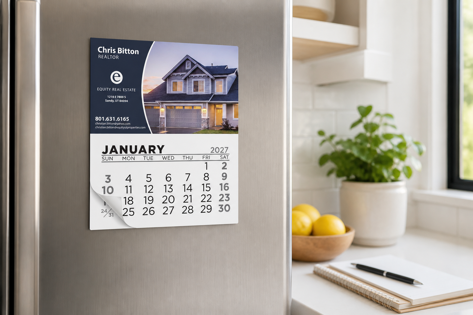 Add-A-Pad 12 Month Calendar displayed on a refrigerator in a bright home workspace