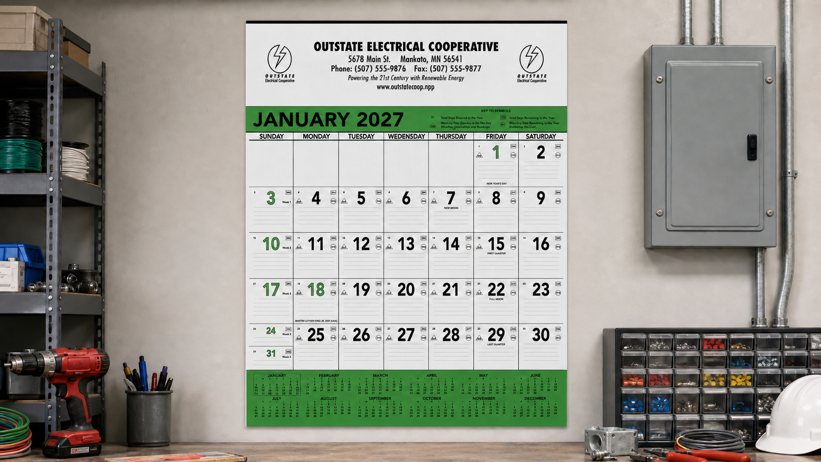 Green and Black Contractor Memo Calendar displayed in a professional workspace